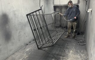 Iron railing being powder coated at Louisville Iron Works